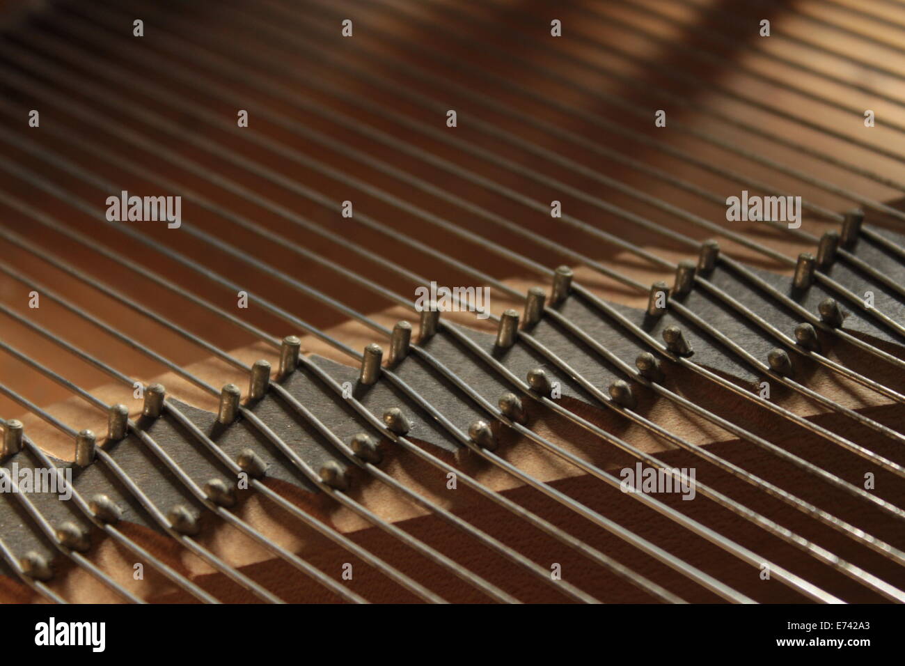 Piano strings hit by morning soft light Stock Photo