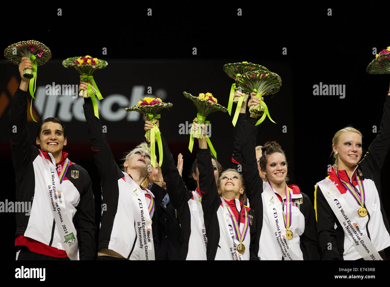 Caen, France. 05th Sep, 2014. Johannes Kay (L-R), Julia Dammer, Pauline Riedl, Mona Pavetic, Jessica Schmitz (hidden), Janika Derks and Milena Hiemann of Germany celebrate on the podium after the Vaulting competition during the World Equestrian Games 2014 in Caen, France, 05 September 2014. The german team won the gold medal. Photo: Rolf Vennenbernd/dpa/Alamy Live News Stock Photo