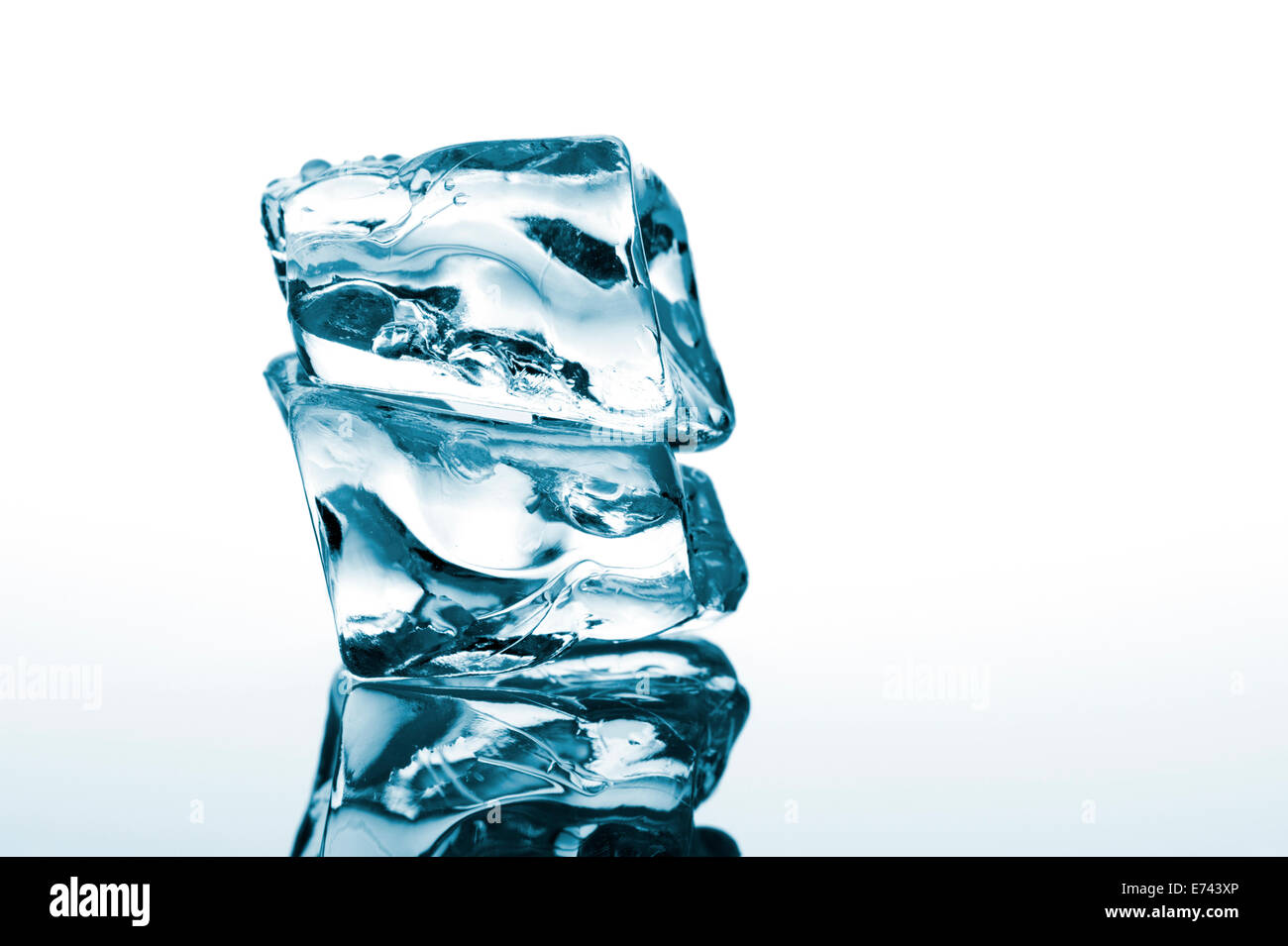 ice cube on white background with reflection Stock Photo - Alamy
