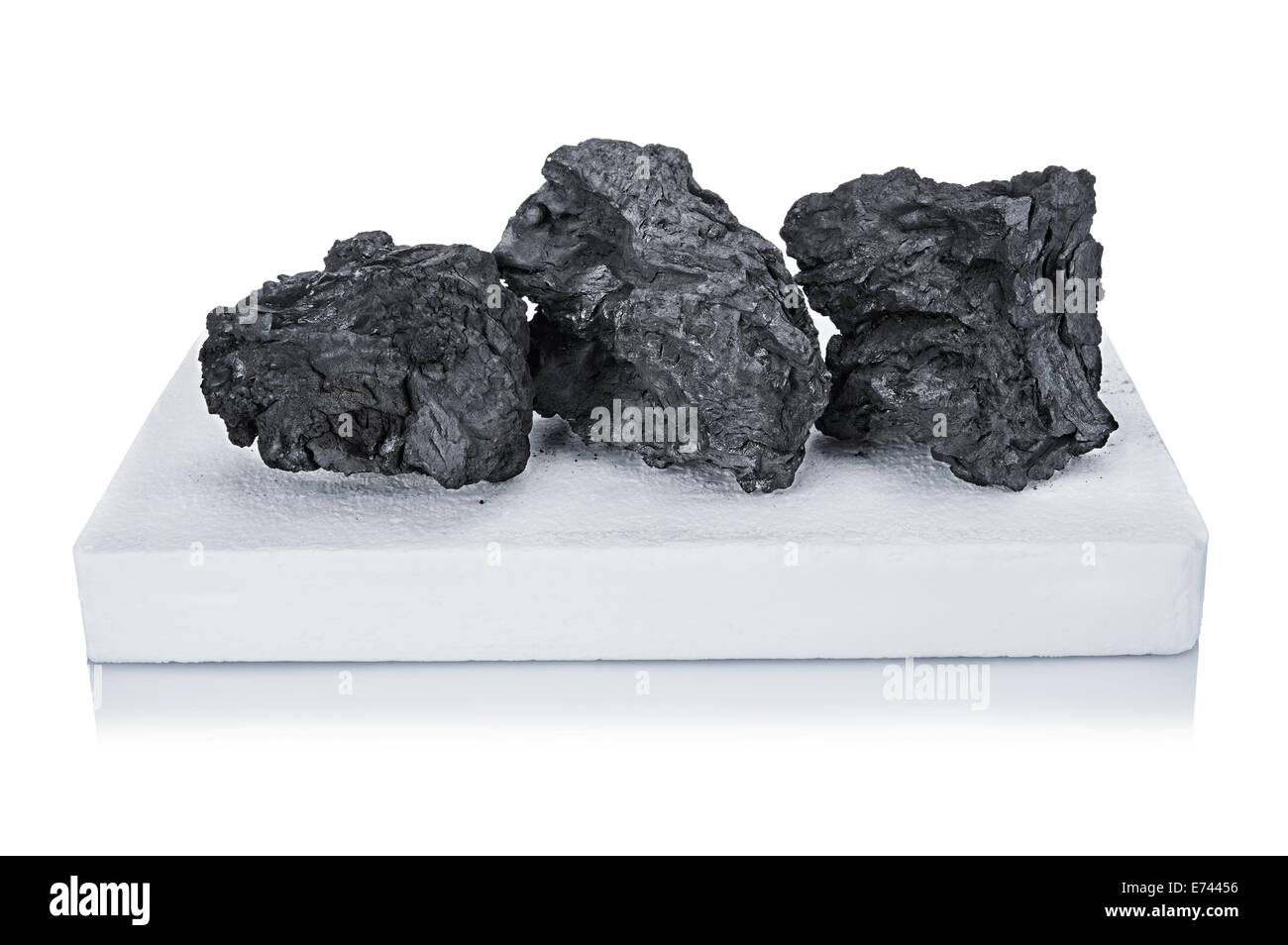 black charcoal and white firelighter for BBQ isolated on white Stock