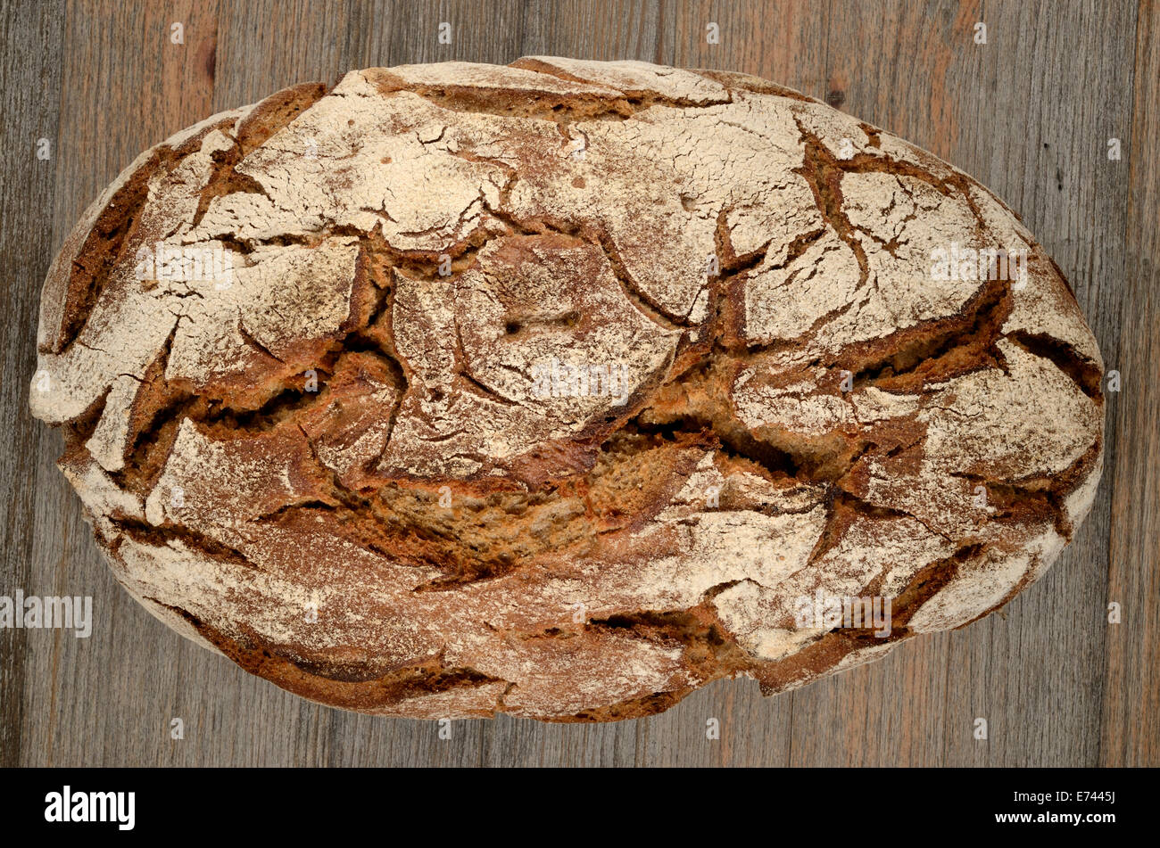 a loaf of rye bread on wood on wood Stock Photo