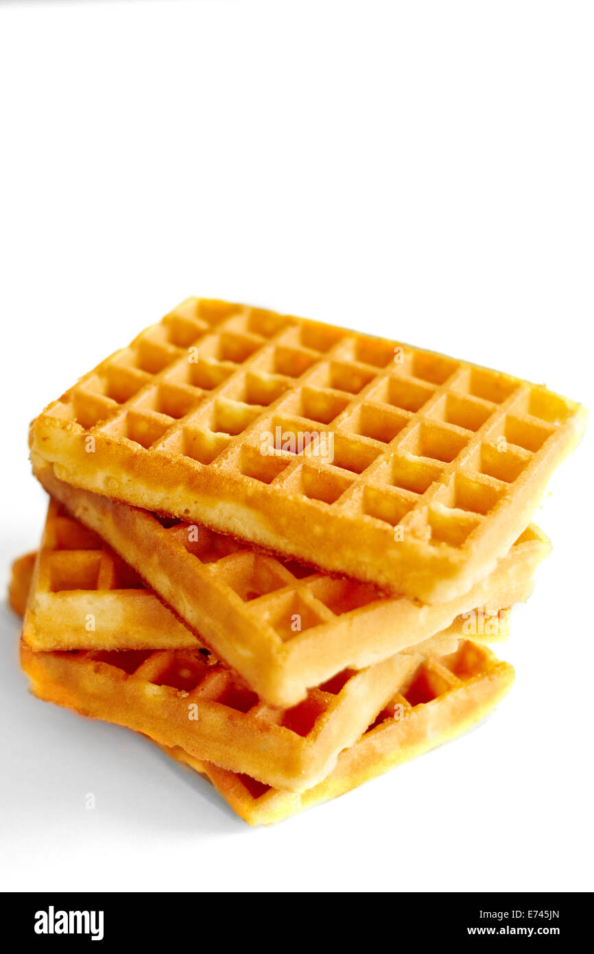 Stack of belgian waffles on simple background Stock Photo