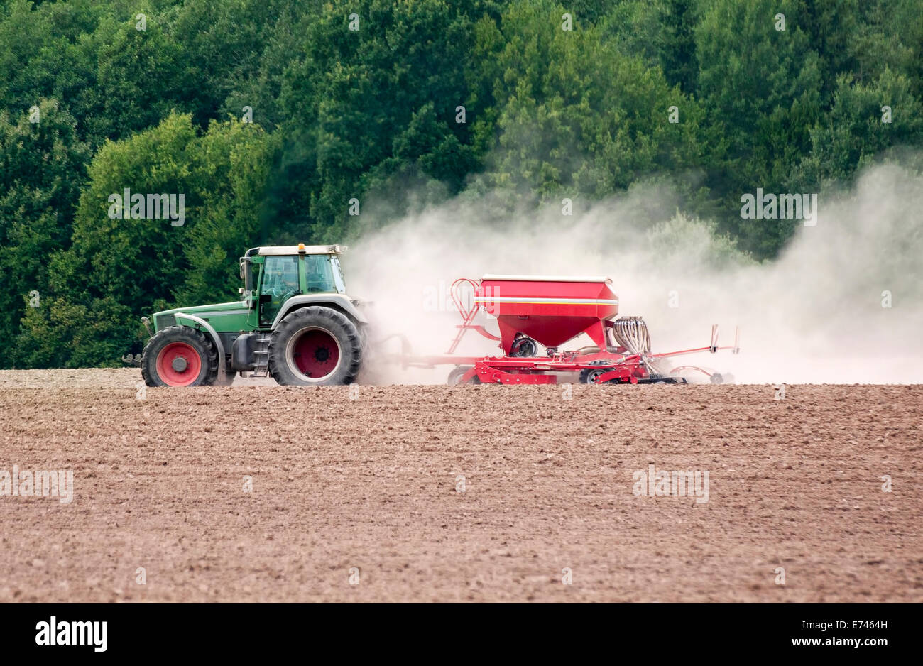 Farm tractor on field Stock Photo - Alamy