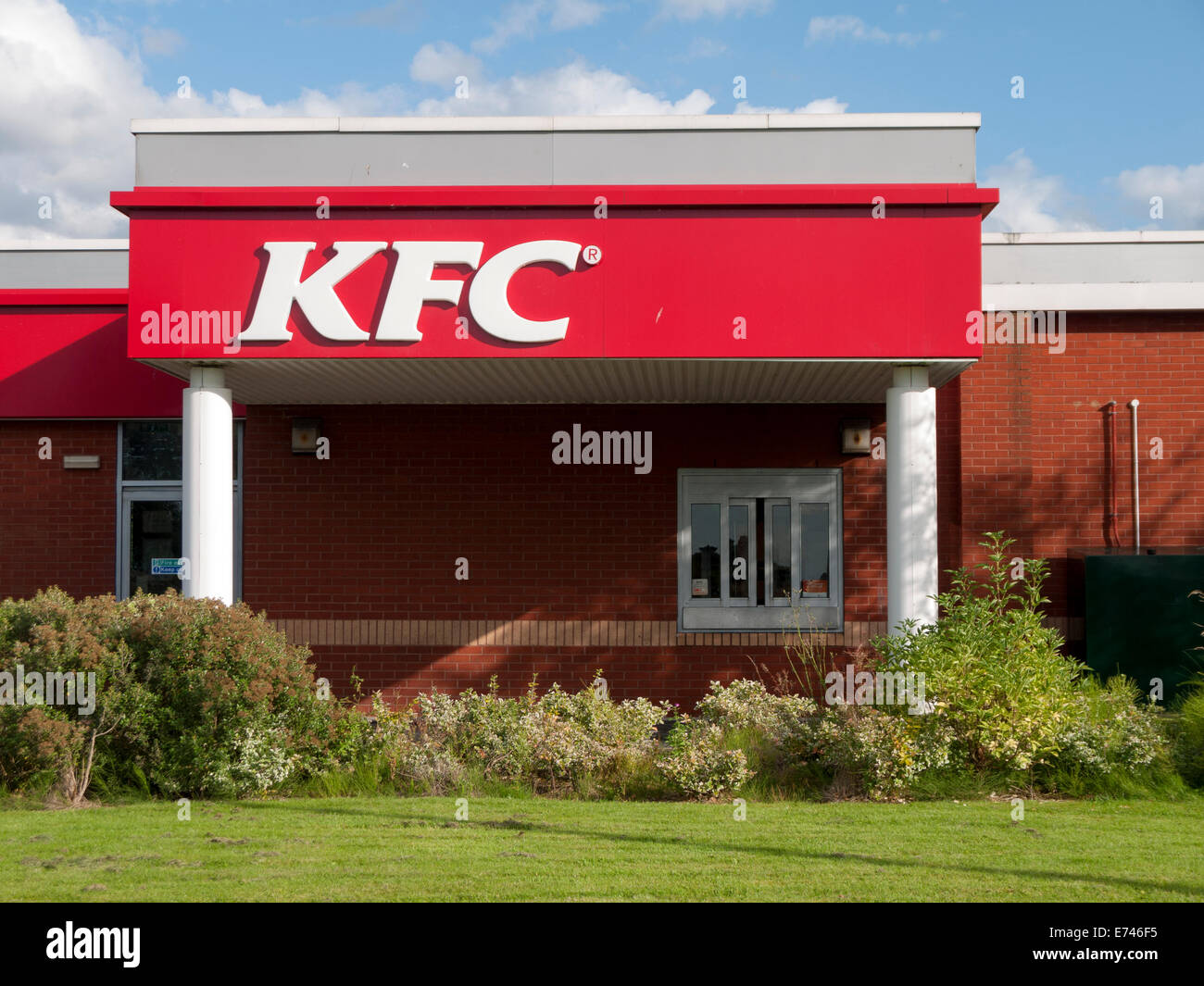 KFC drive-thru serving hatch and sign, Ashton Retail Park, Ashton under Lyne, Tameside, Manchester, England, UK Stock Photo