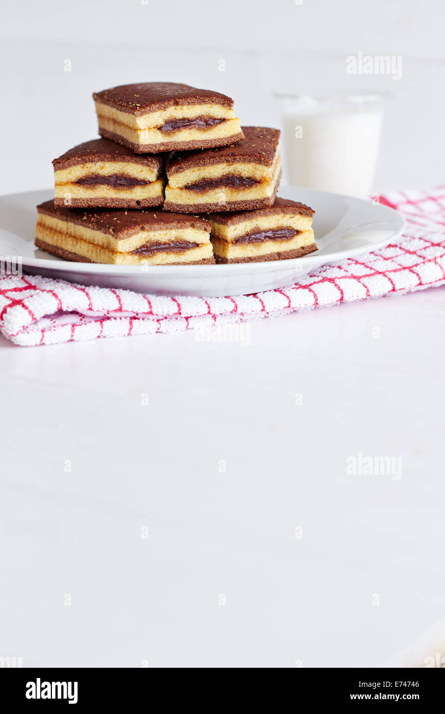 Cookies and milk on white table Stock Photo Alamy