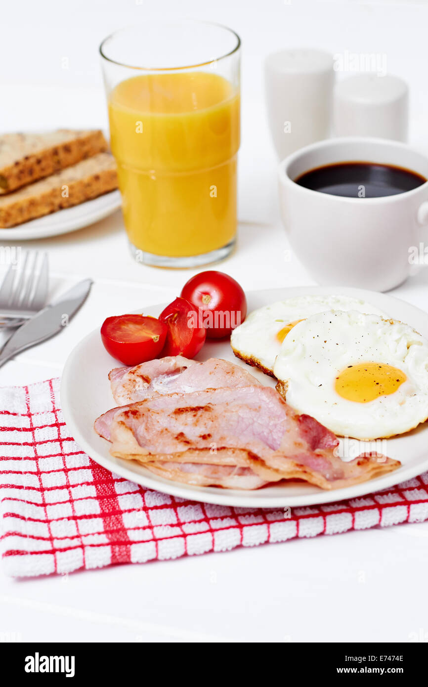 Breakfast with eggs and bacon, orange juice Stock Photo Alamy