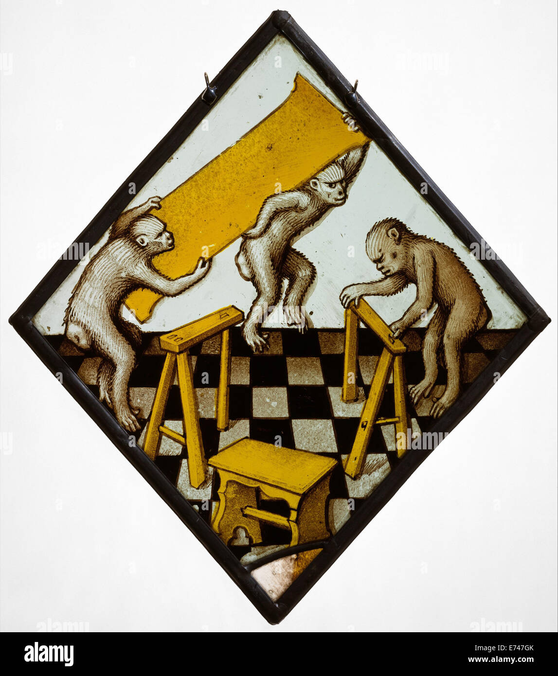Stained glass with Three Apes Building a Trestle Table, 1480 Stock Photo