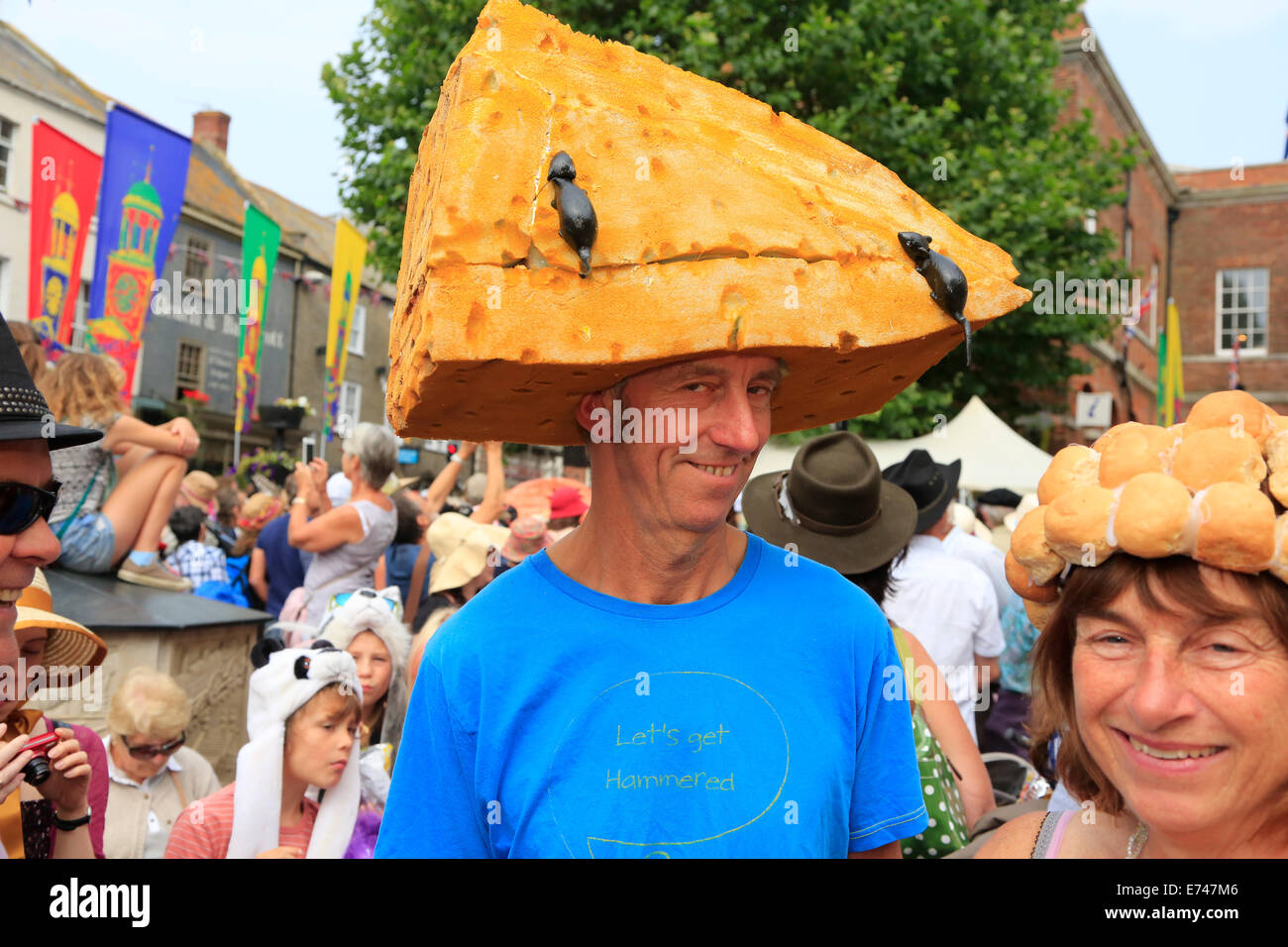 Bridport, Dorset, UK. 6th September 2014. Hat wearers gather and promenade in Bridport. The annual Bridport Hat Festival encourages residents and visitors to take part in hat related activities and and competitions including best hats, best hatted dog, and most elegantly-hatted couple. Credit:  Tom Corban/Alamy Live News Stock Photo