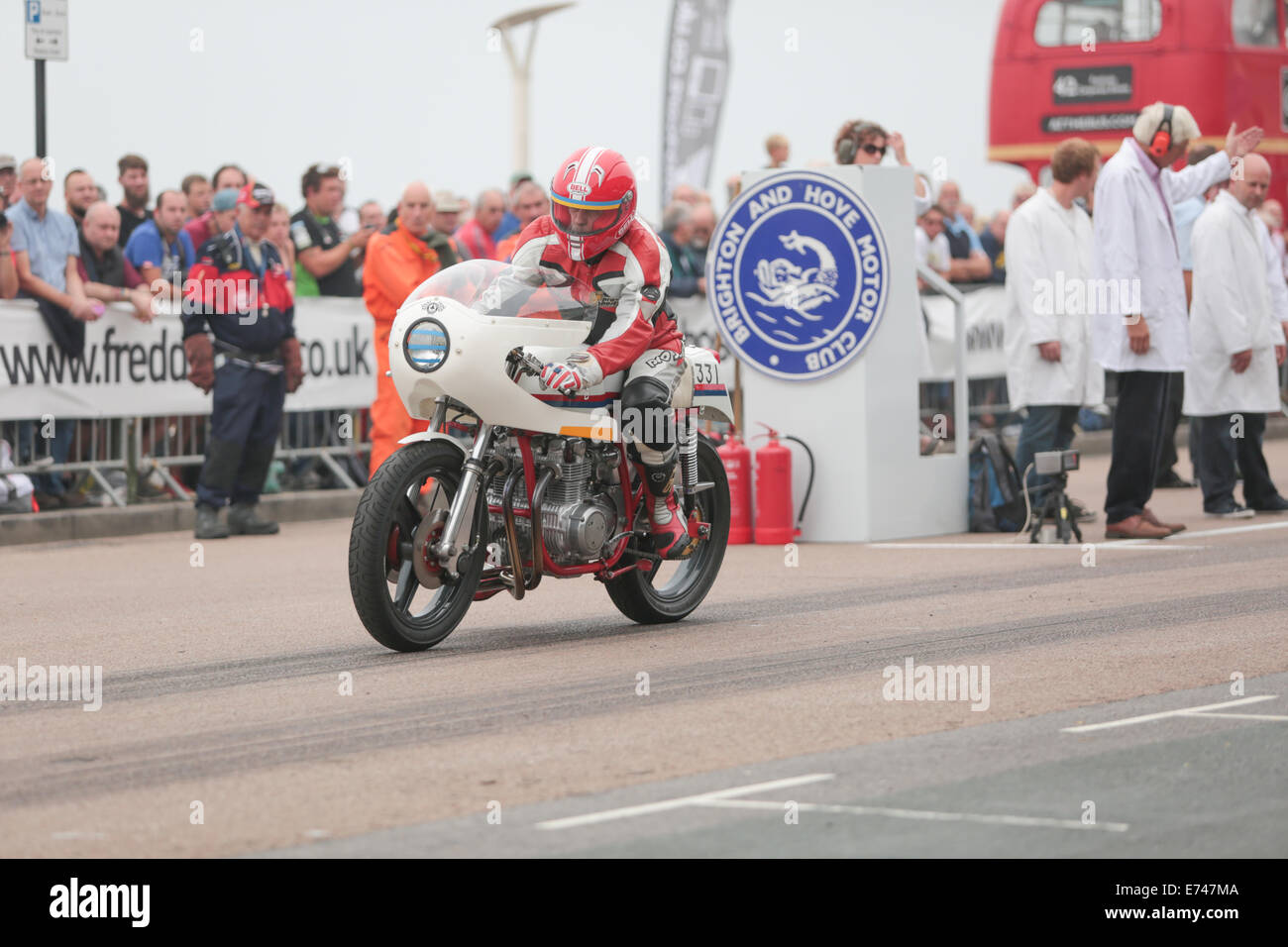 This is Mike Gilbert riding a Dresda Honda 500/4 at the Brighton National Speed Trials organised by the Brighton & Hove Motor Club held annually at Madeira Drive, Brighton Seafront, Brighton, East Sussex, UK. 6th September 2014 Stock Photo