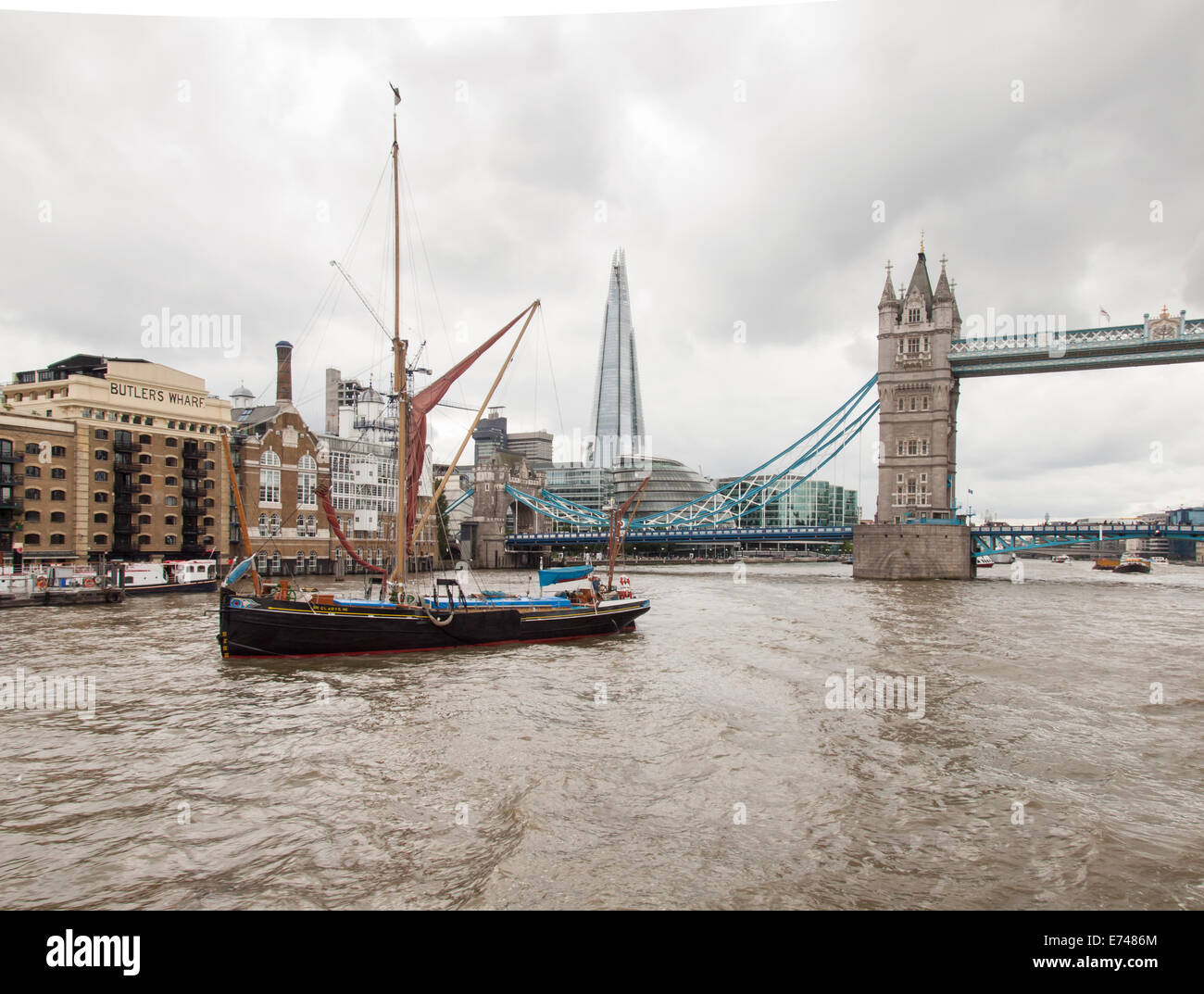 traditional thames barge the galdys on the river thames with, tower bridge, city hall, the shard and more london riverside devel Stock Photo