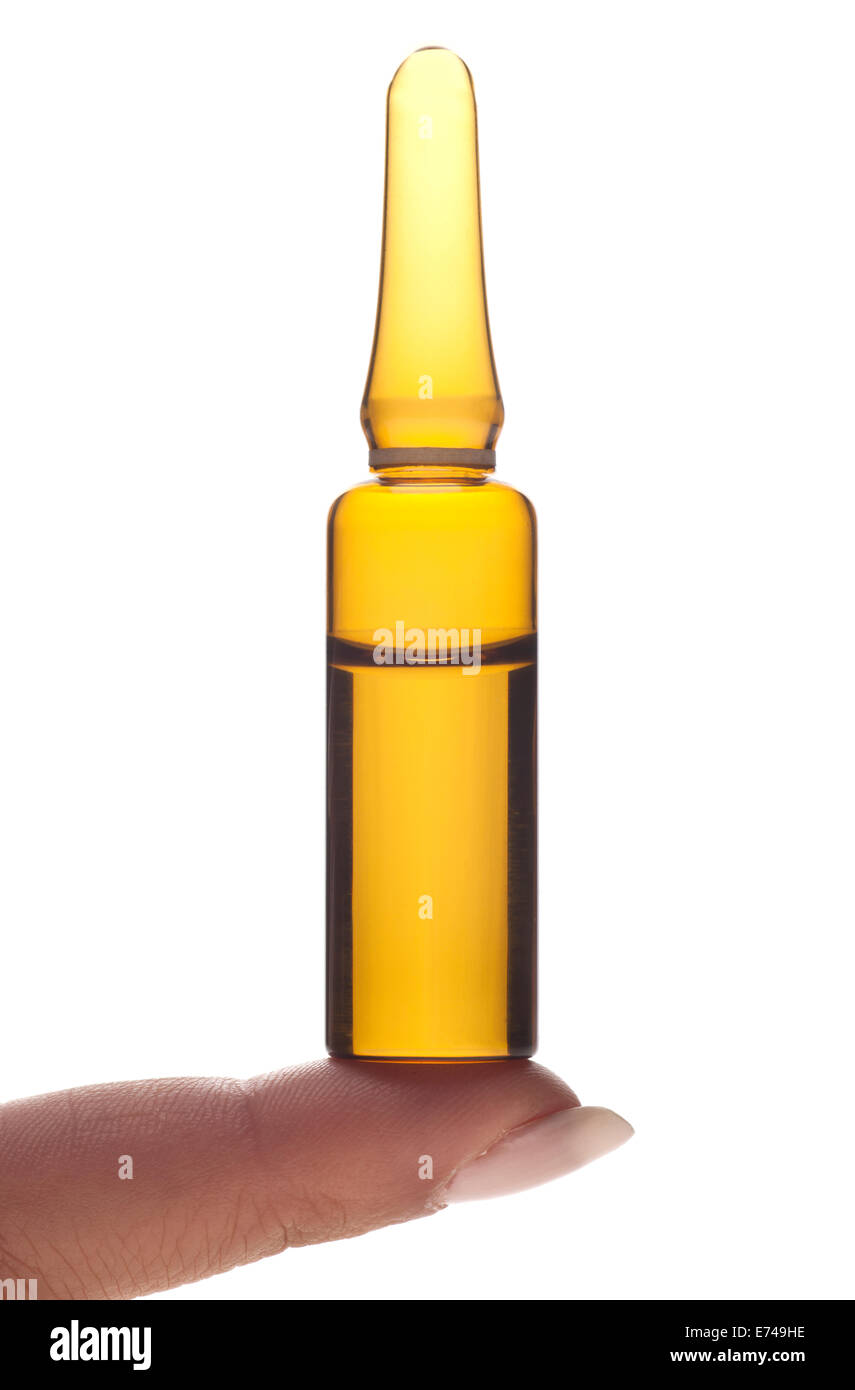 Finger holding an ampoule on a white background Stock Photo