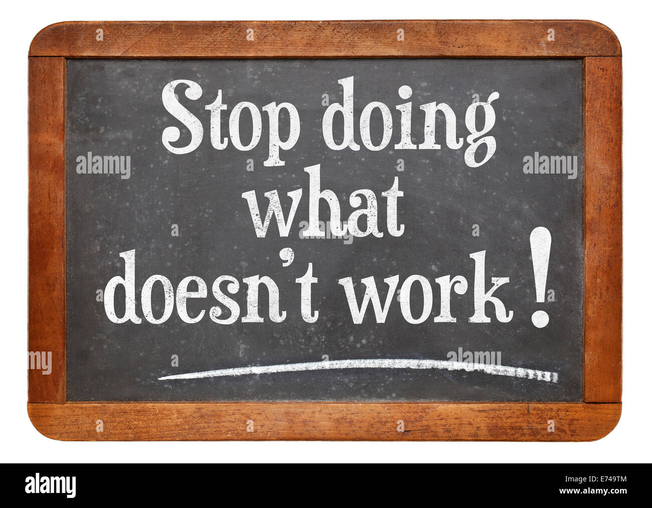 stop doing what does not work  advice on a vintage slate blackboard Stock Photo