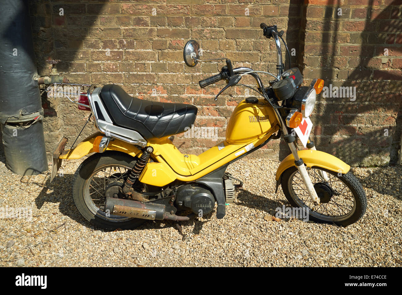 Yellow miniature scooter Stock Photo - Alamy