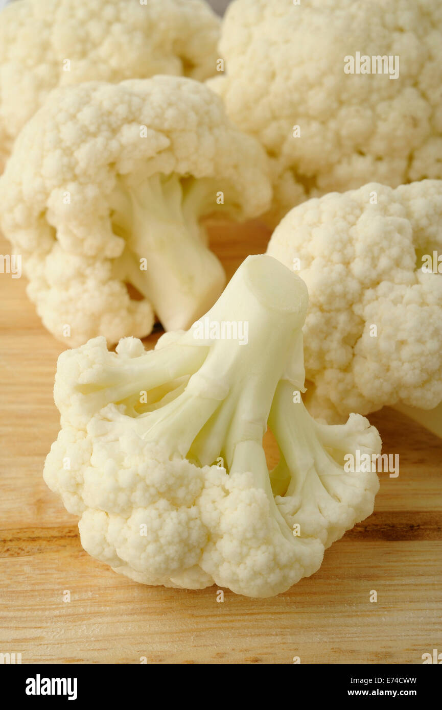 cauliflower on wooden kitchen board Stock Photo