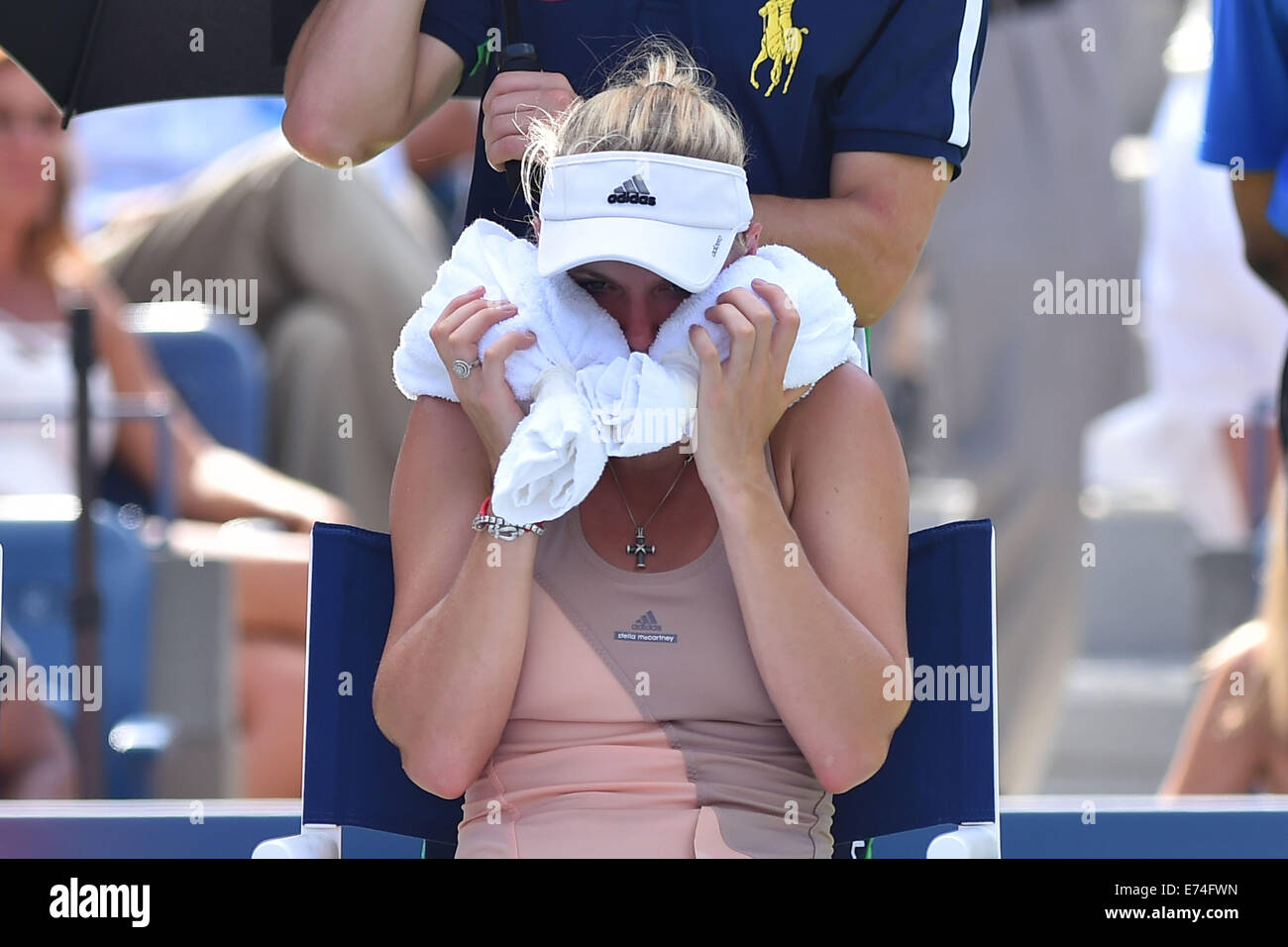 Flushing Meadows, New York, USA. 05th Sep, 2014. Wozniacki tries to cooll down against Peng (Chn) in the 1st womens semi-final. Wozniacki won in 2 sets as Peng retired injured © Action Plus Sports/Alamy Live News Stock Photo
