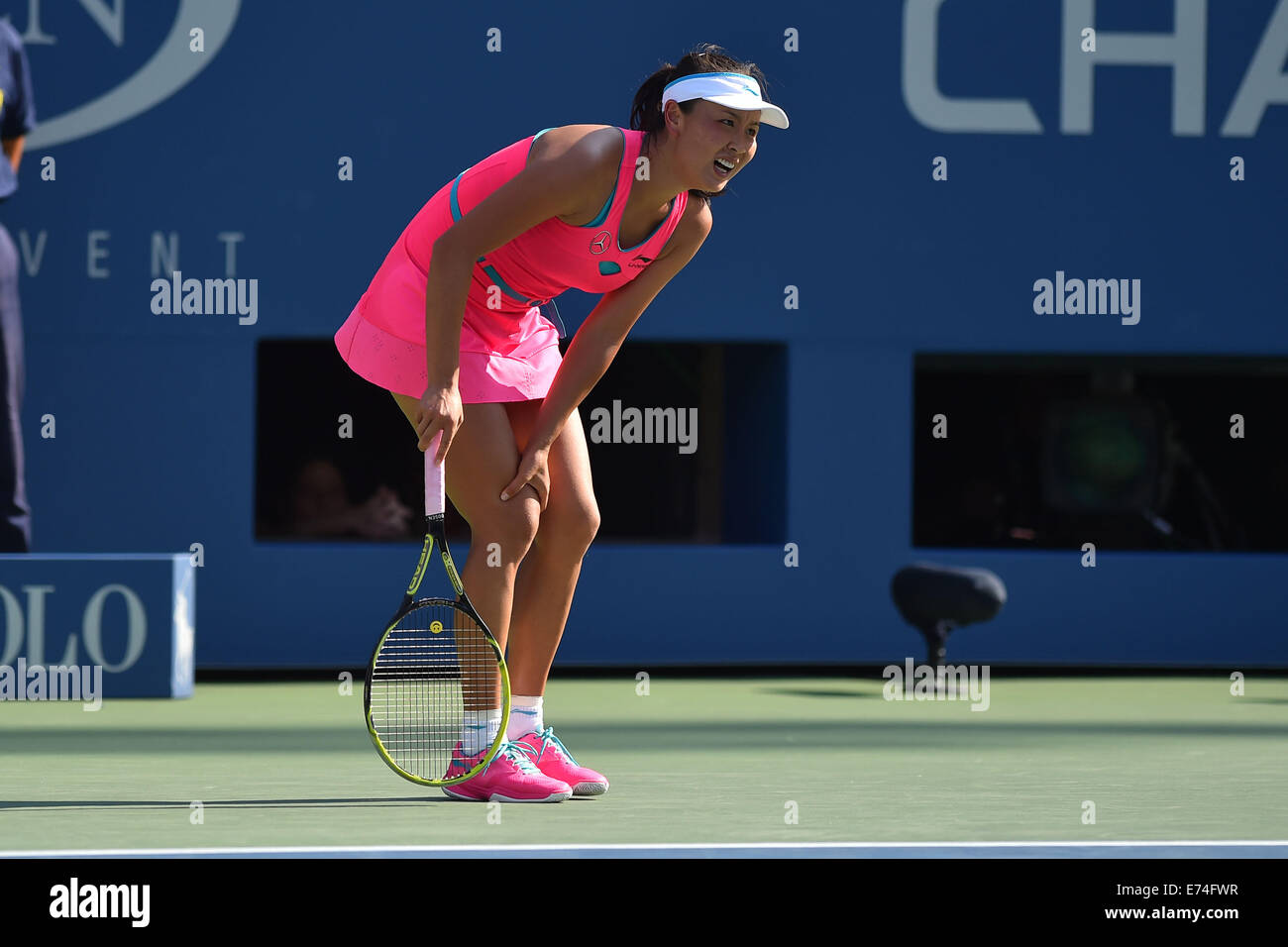 Flushing Meadows, New York, USA. 05th Sep, 2014. Shuai Peng (CHN) gets cramps at US Open 2014, pumps her fist as she plays Wozniacki in the 1st womens semi-final. Wozniacki won in 2 sets as Peng retired injured © Action Plus Sports/Alamy Live News Stock Photo