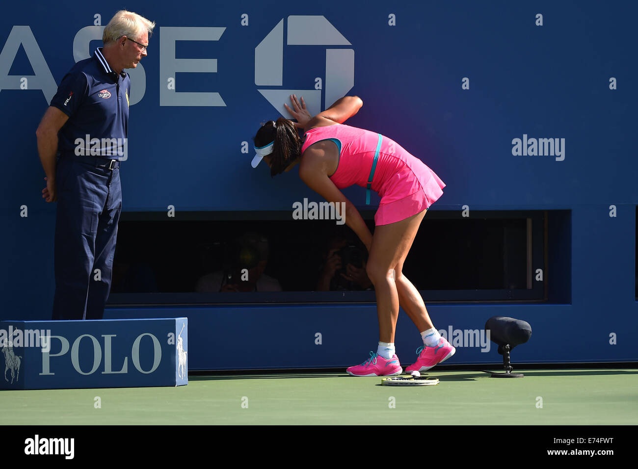 Flushing Meadows, New York, USA. 05th Sep, 2014. Shuai Peng (CHN) gets cramps at US Open 2014, pumps her fist as she plays Wozniacki in the 1st womens semi-final. Wozniacki won in 2 sets as Peng retired injured © Action Plus Sports/Alamy Live News Stock Photo