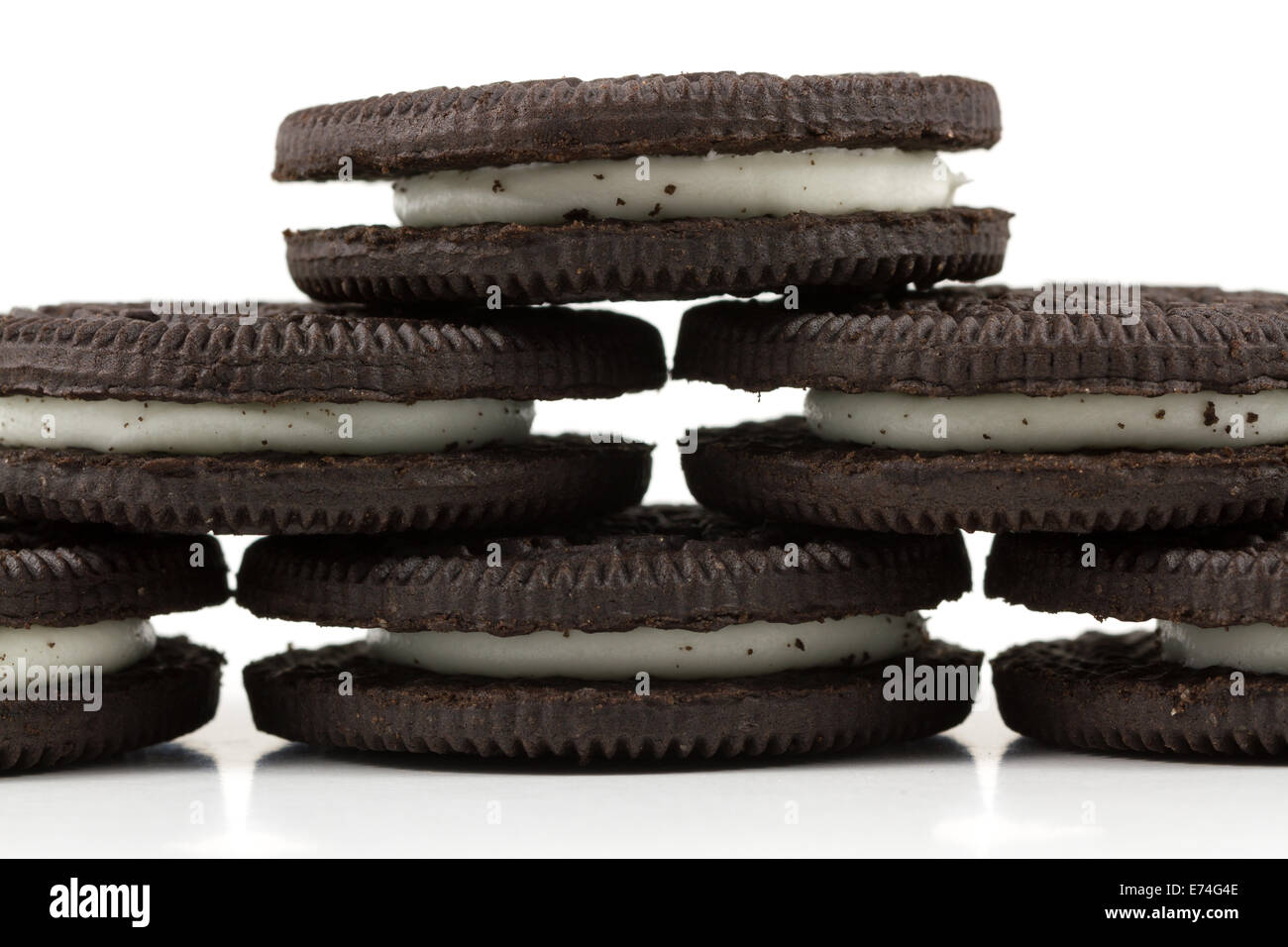 Chocolate cookies with cream filling on white background. Stock Photo