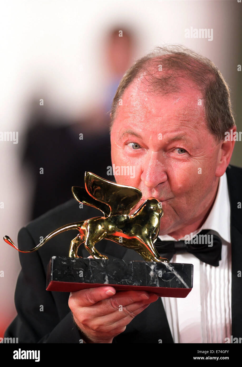 Venice, Lido of Venice. 6th Sep, 2014. Director Roy Andersson kisses Golden Lion for Best Film