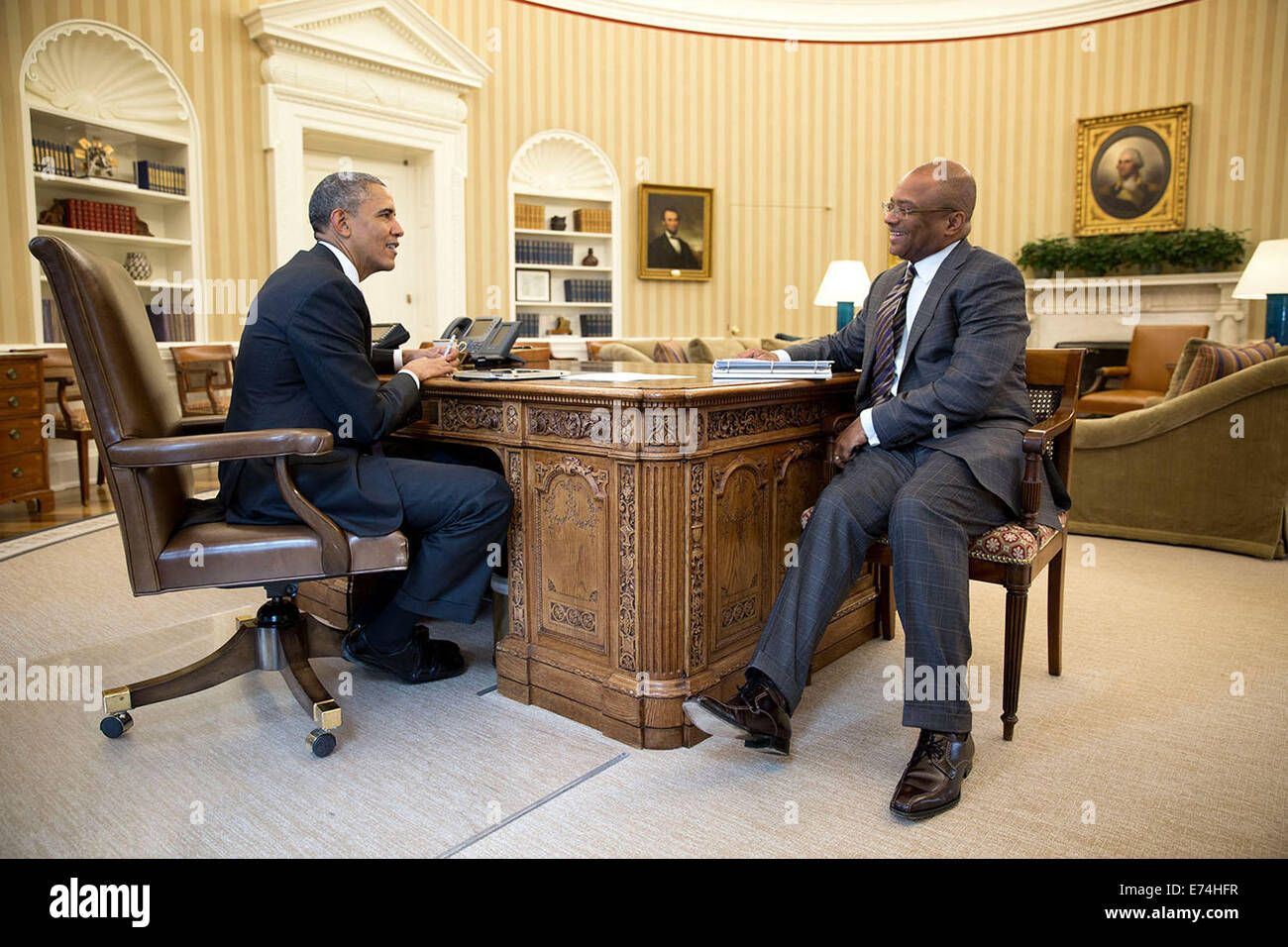 President Barack Obama meets with Cabinet Secretary Broderick Johnson in the Oval Office, May 21, 2014. Stock Photo
