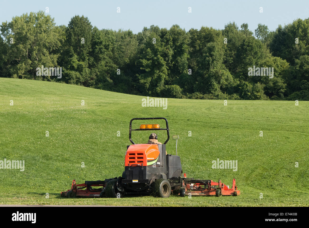 Lawn mower in action. Stock Photo