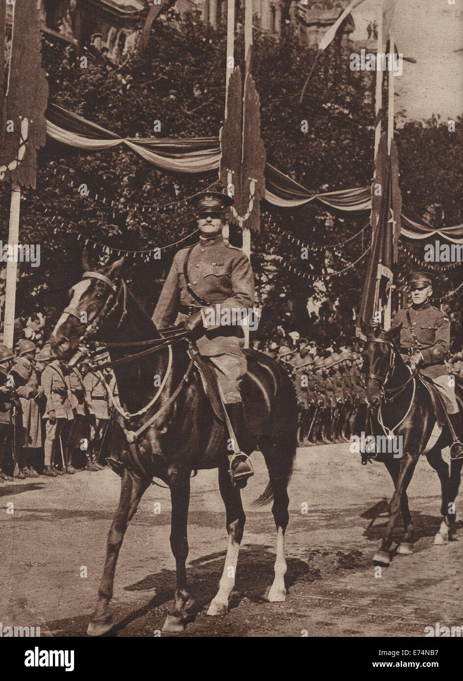 General John J Pershing at Head of American Troops on Bastille Day in Paris, 1919, with orderly carrying flag denoting General's rank Stock Photo