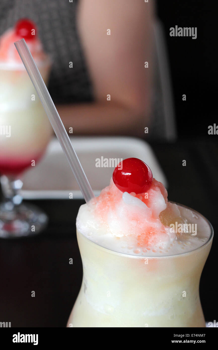 Frosted beverages with cherries on top Stock Photo Alamy