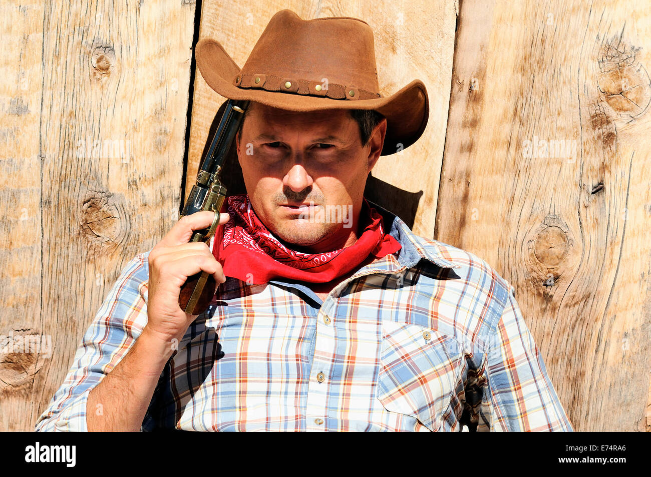 OUT WEST - A cowboy takes time to rest and reflect. Stock Photo