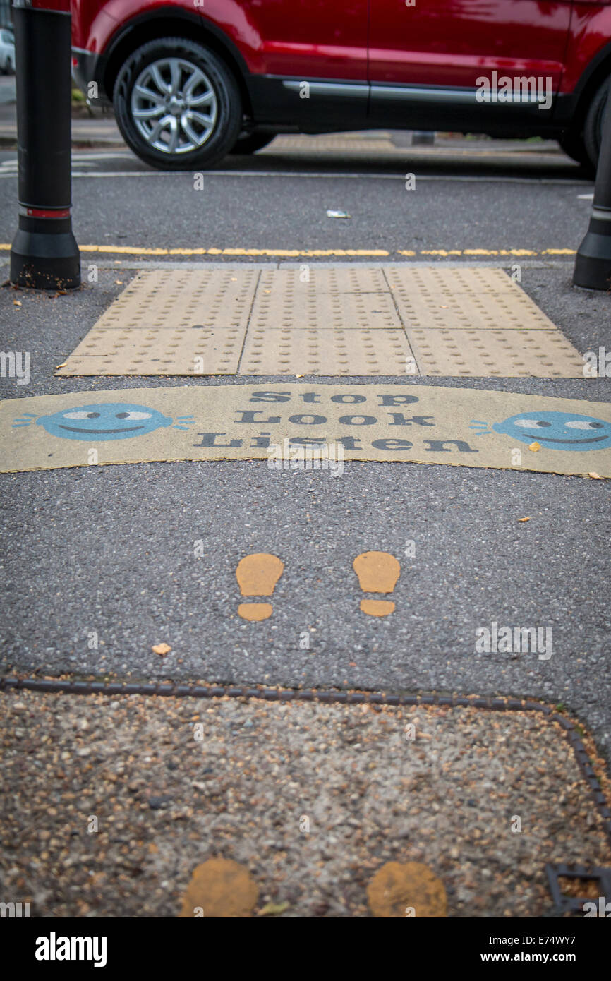 children road safety markings on a pavement Stock Photo