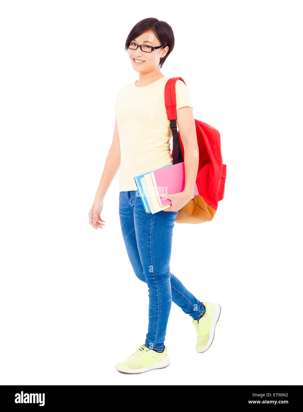 smiling young student girl standing and holding book Stock Photo - Alamy