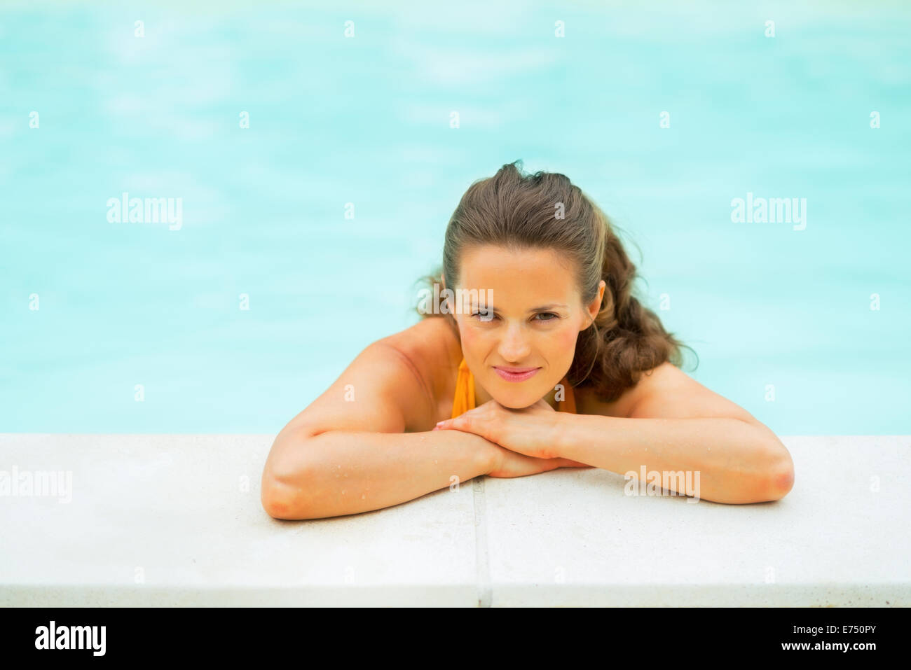 Portrait of relaxed young woman in swimming pool Stock Photo - Alamy