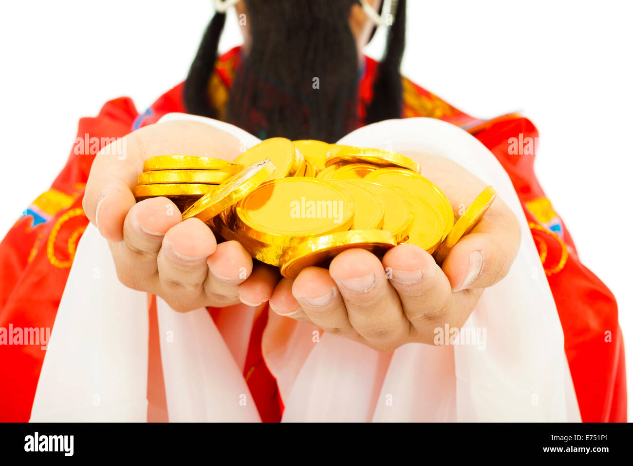 closeup of  God of wealth holding gold coin. Stock Photo