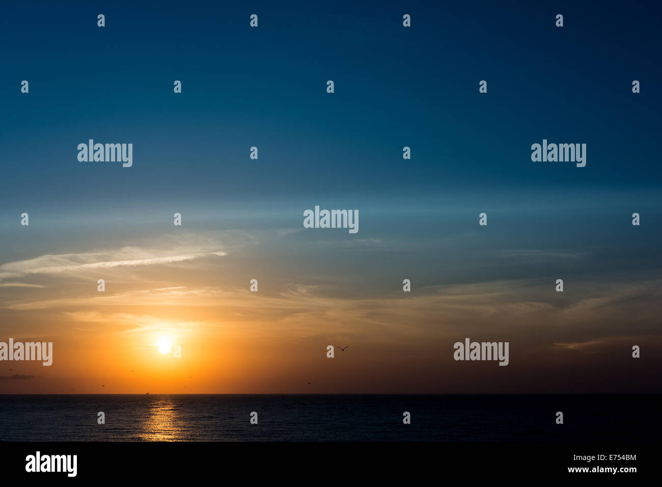 Sun Rise Over The Ocean Stock Photo