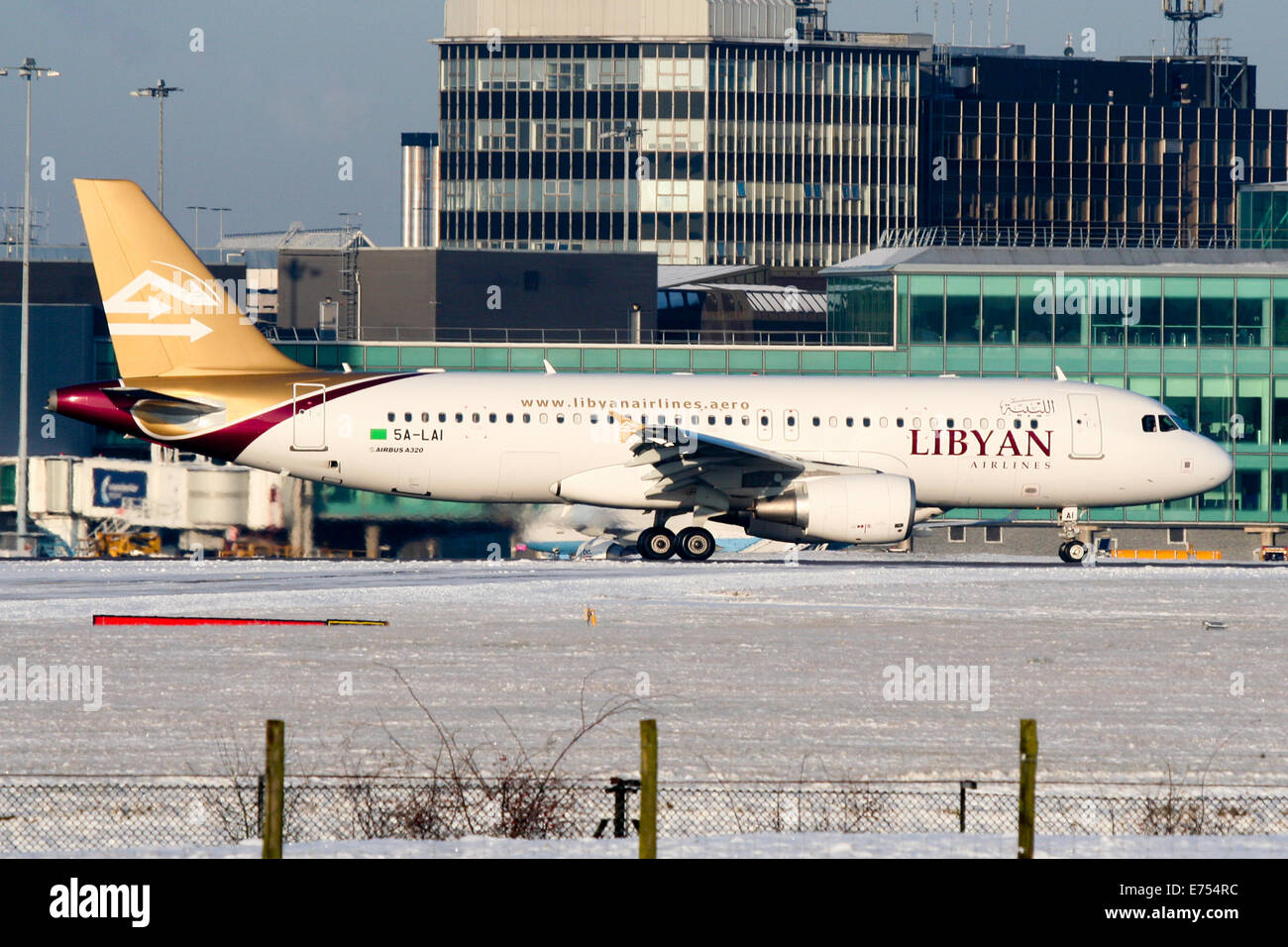 Libyan Airlines Airbus A320 arrives into Manchester airport. The aircraft has since been destroyed by rebels in Libya. Stock Photo