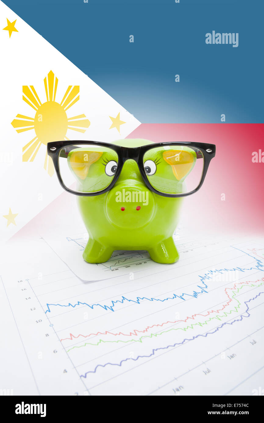 Piggy bank with flag on background - Philippines Stock Photo