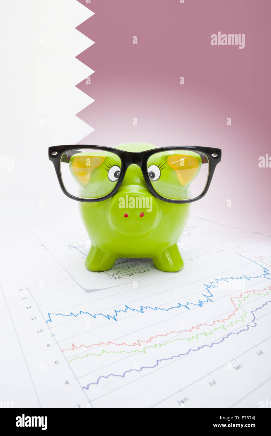Piggy bank with flag on background Qatar Stock Photo Alamy