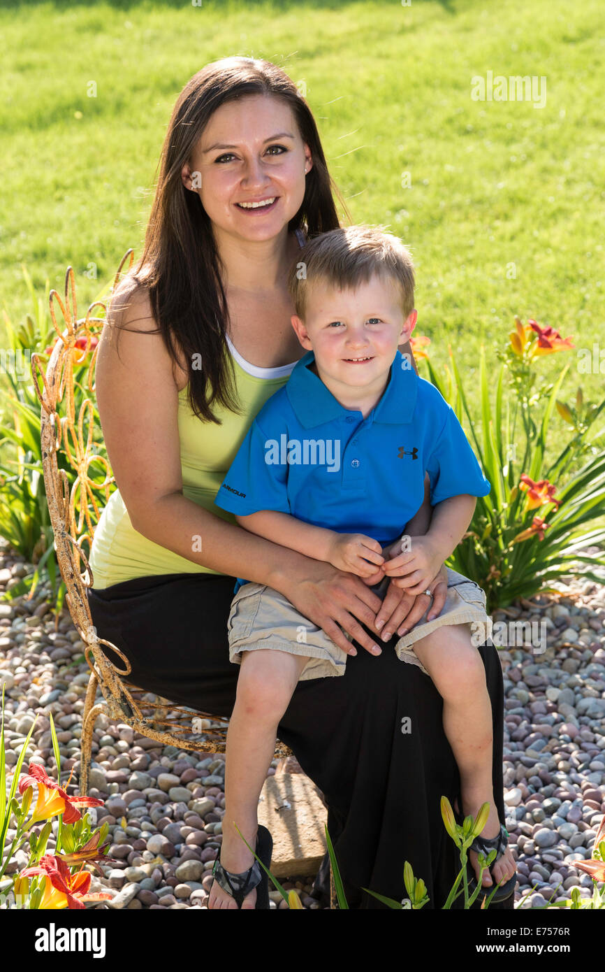 Mother and Son Smiling at Camera in Backyard, USA Stock Photo