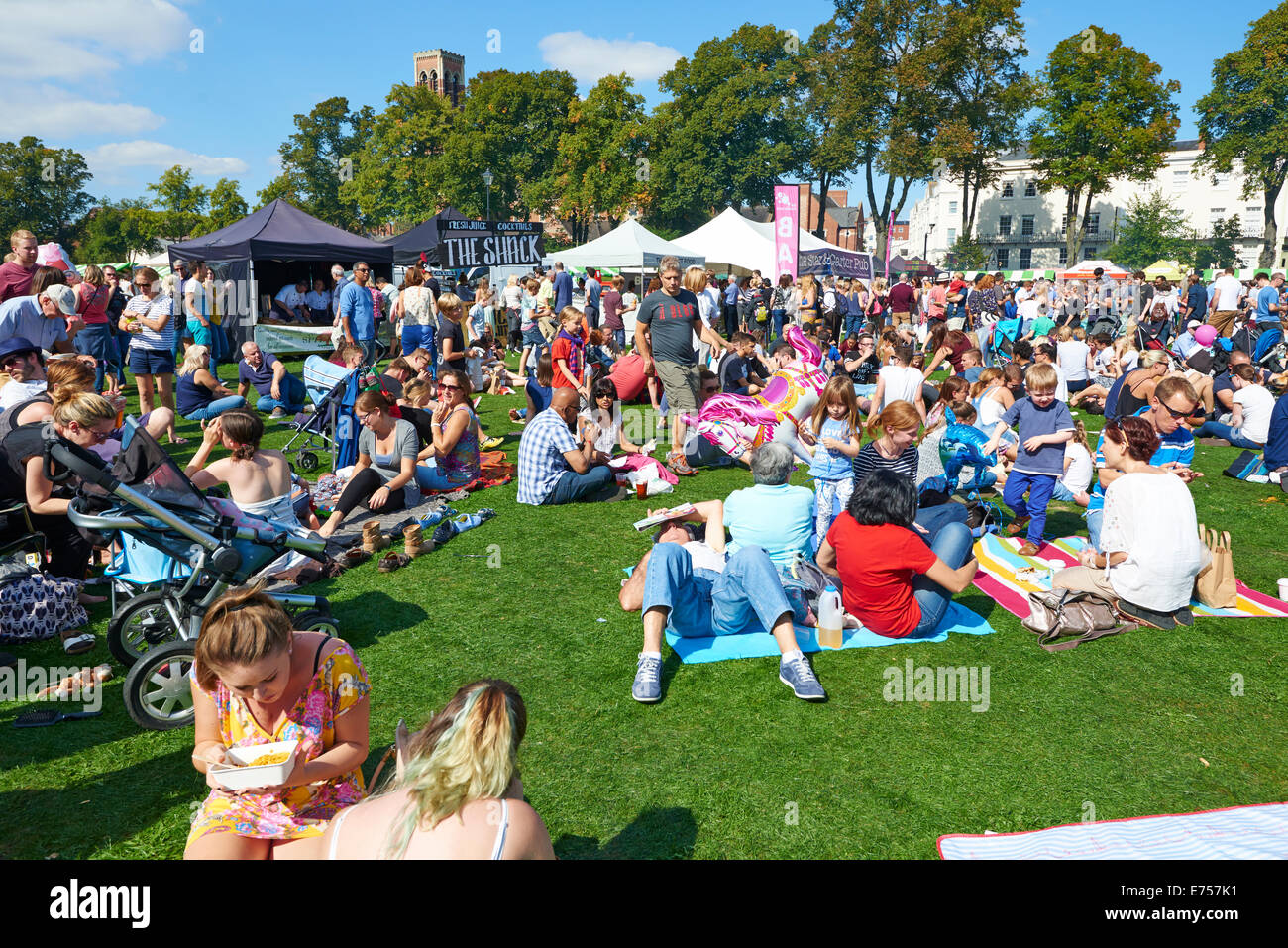 Crowds Sitting On The Grass Enjoying The Food And Drink Festival