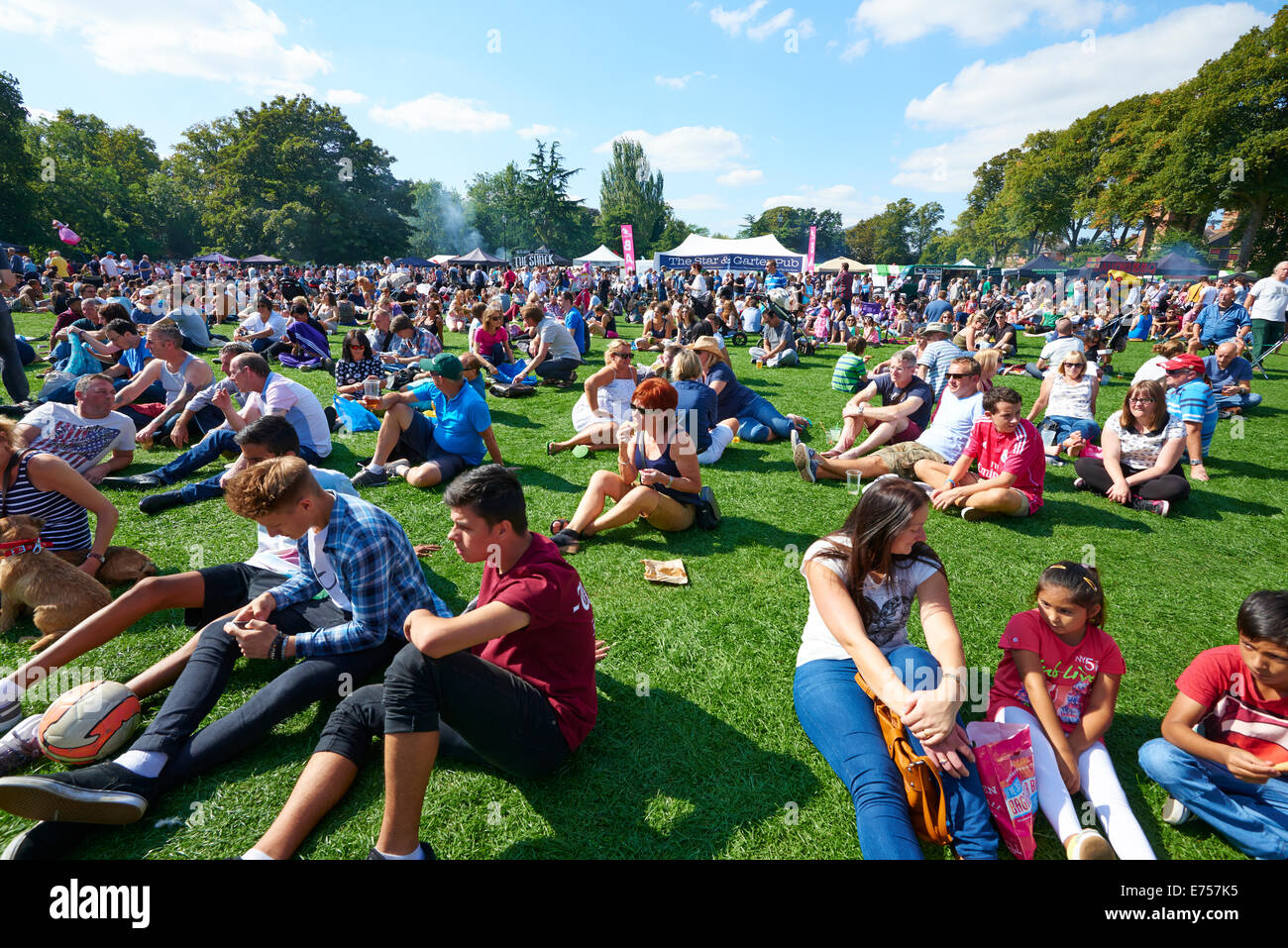 Crowds Sitting On The Grass Enjoying The Food And Drink Festival