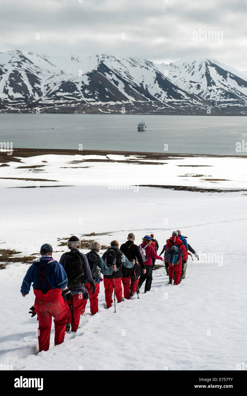 Tourists hiking on snow Recherfjorden Svalbard Norway Arctic Circle Scandinavia Europe Stock Photo