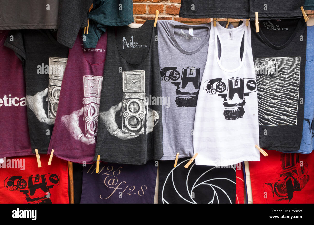 Tank tops and T-Shirts with camera illustration in Nolita in New York City Stock Photo