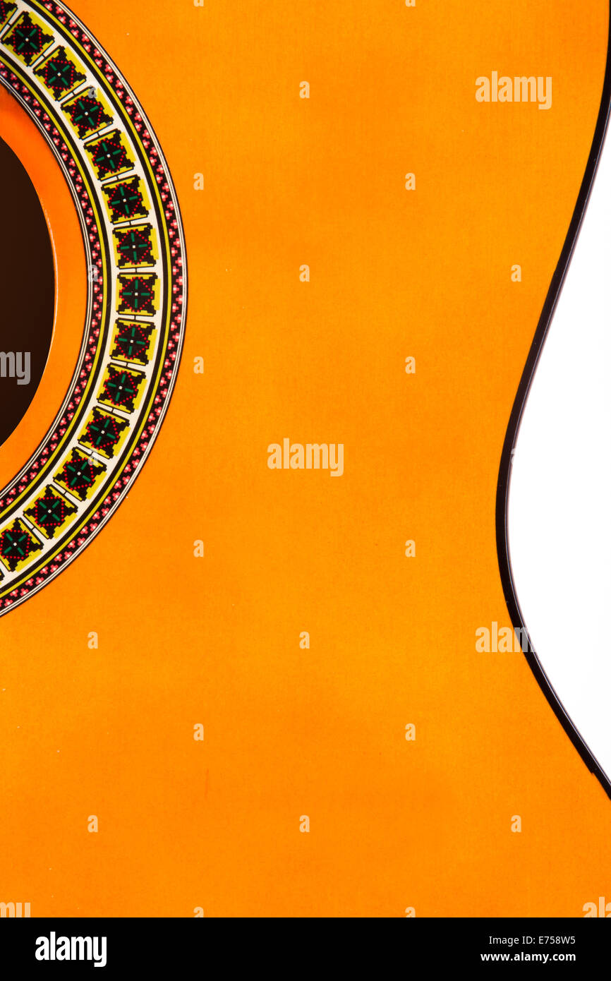 Detail of orange wooden classical acoustic guitar. Stock Photo