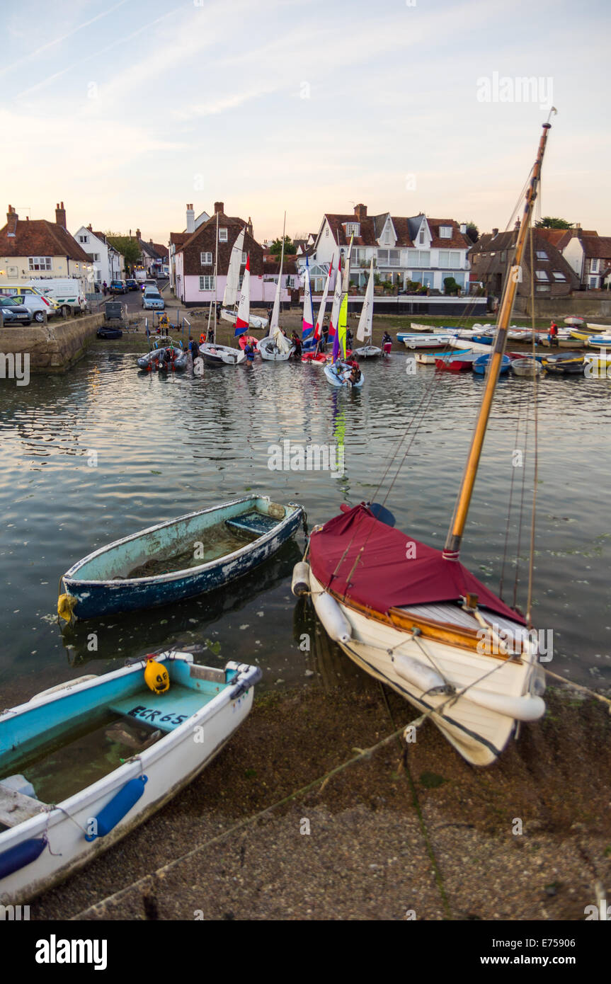 Sailing dingies arriving back to the Emsworth slipway at the end of a days sail Stock Photo