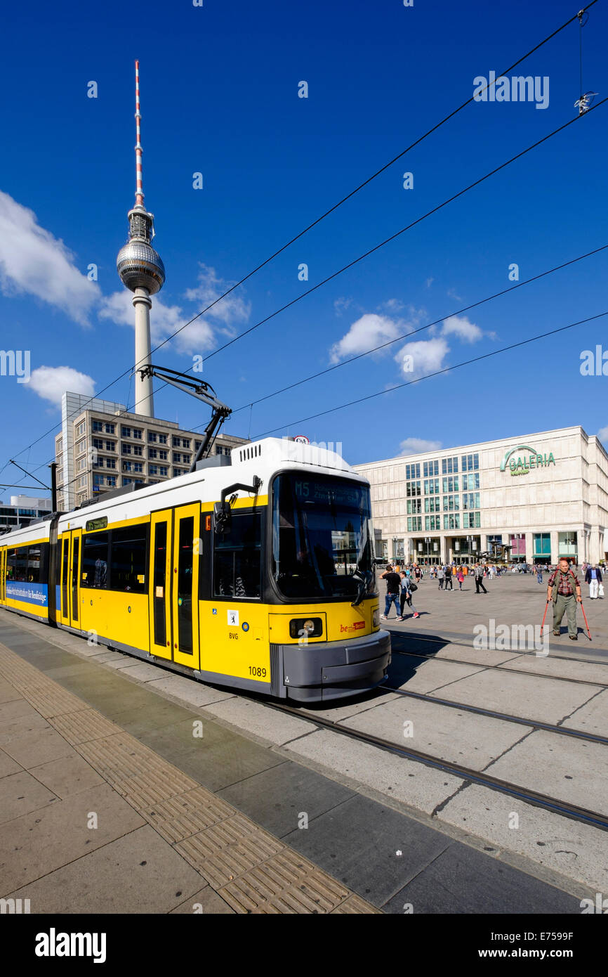 View of Alexanderplatz with yellow tram in Mitte Berlin Germany Stock Photo