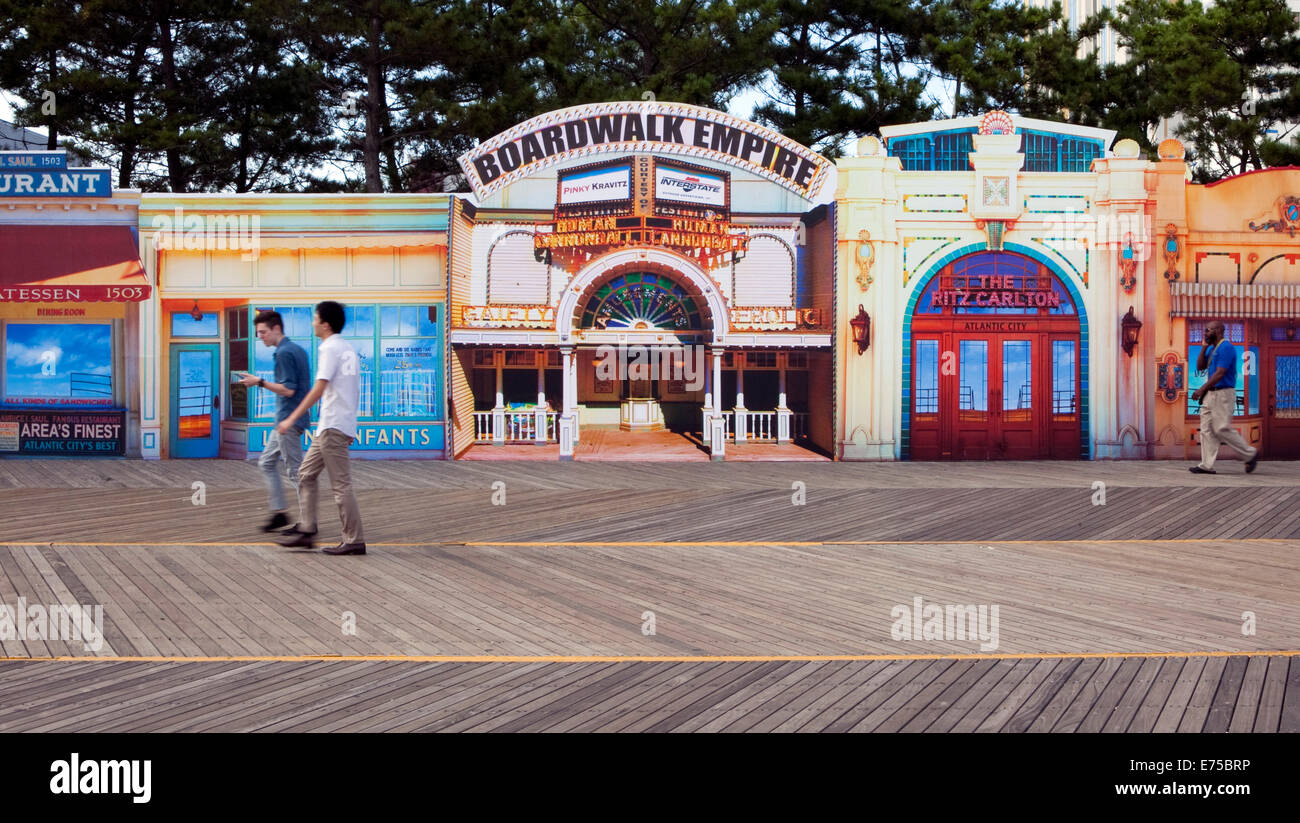 People walk in front of a display for tv show Boardwalk Empire on the boardwalk at Atlantic City, New Jersey Stock Photo
