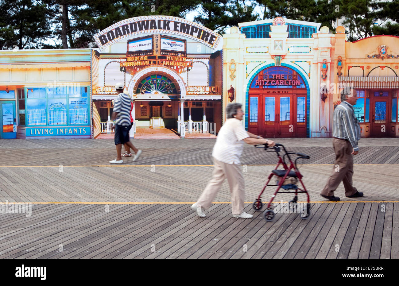 People walk in front of a display for tv show Boardwalk Empire on the boardwalk at Atlantic City, New Jersey Stock Photo