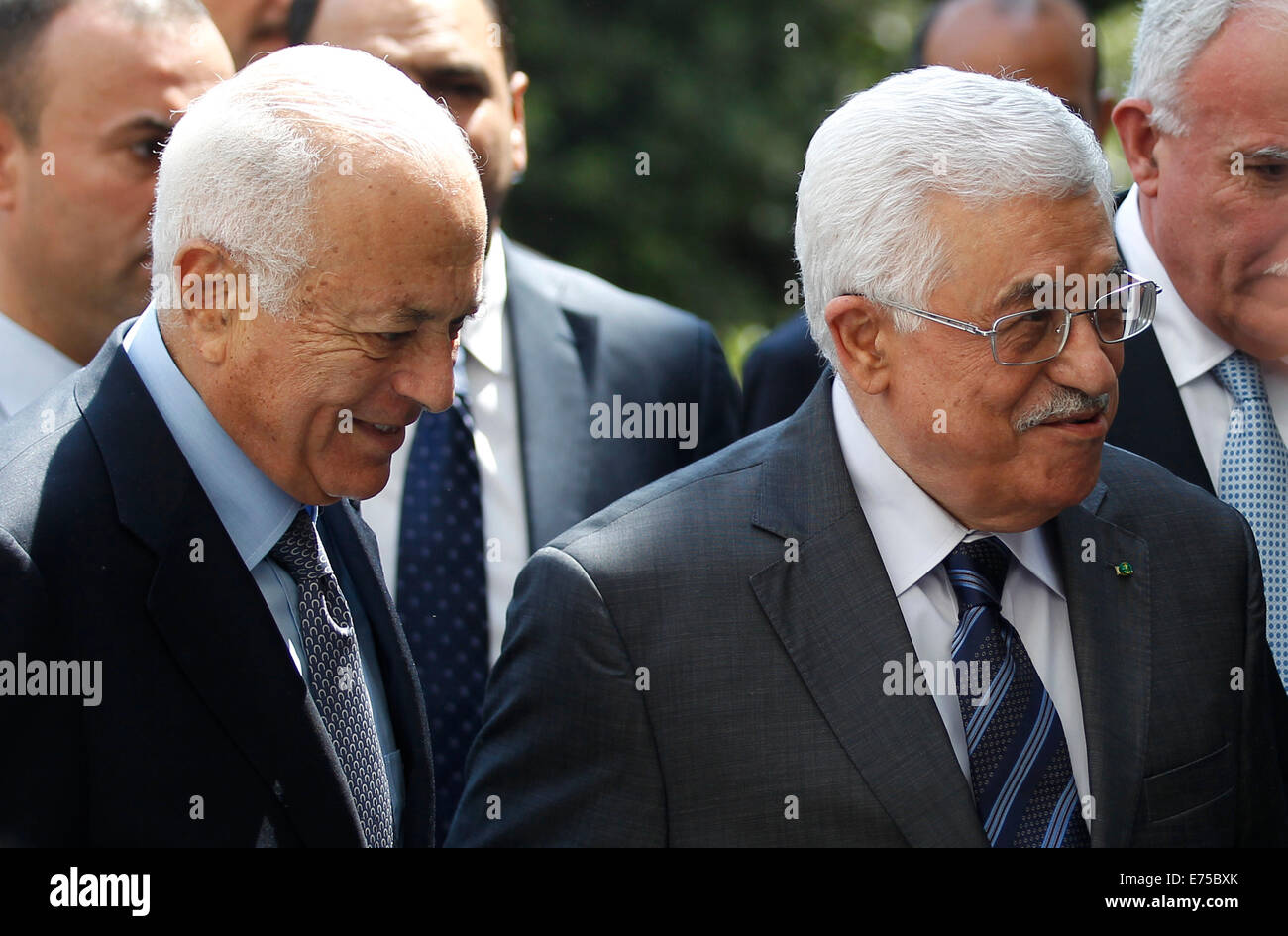 Cairo, Egypt. 7th Sep, 2014. Arab League Secretary General Nabil al-Arabi (L) and Palestinian President Mahmoud Abbas (R) walk into an an Arab League emergency meeting in Cairo, Egypt, Sept. 7, 2014. Arab foreign ministers were expected to issue a resolution to confront militants overrunning large areas of Iraq and Syria and declared a cross-border Islamic States. Credit:  Ahmed Gomaa/Xinhua/Alamy Live News Stock Photo