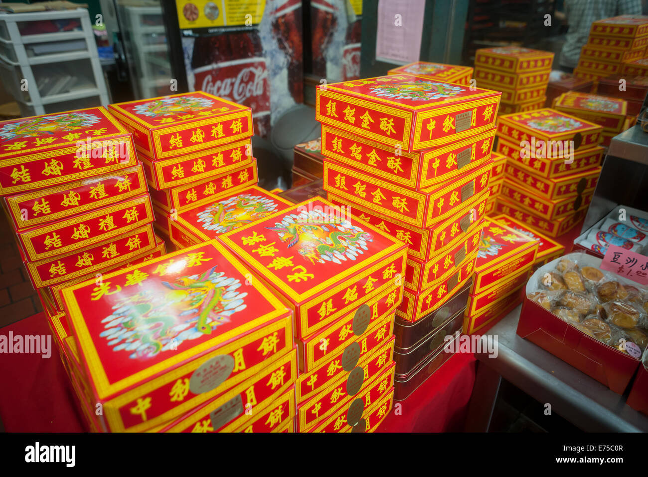 New York, USA. 7th September, 2014. Stores and bakeries in Chinatown in New York sell boxes and boxes of mooncakes on Sunday, September 7, 2014 for the Mid-Autumn Festival which occurs on September 8. The delicious traditional baked product is eaten during the Mid-Autumn festival and are popular as gifts. The perfectly round pastries can be sweet or savory, filled with lotus seed or salted duck egg. The cakes represent the full moon on the eighth month, the fifteenth day in the Chinese (lunar) calendar. Credit:  Richard Levine/Alamy Live News Stock Photo