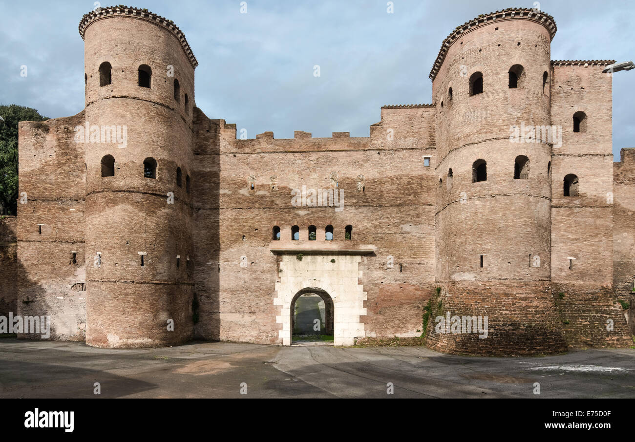 The Porta Asinaria is a gate in the Aurelian Walls of Rome. It was originally a simple gate,but Honorius added two semi-cylindri Stock Photo