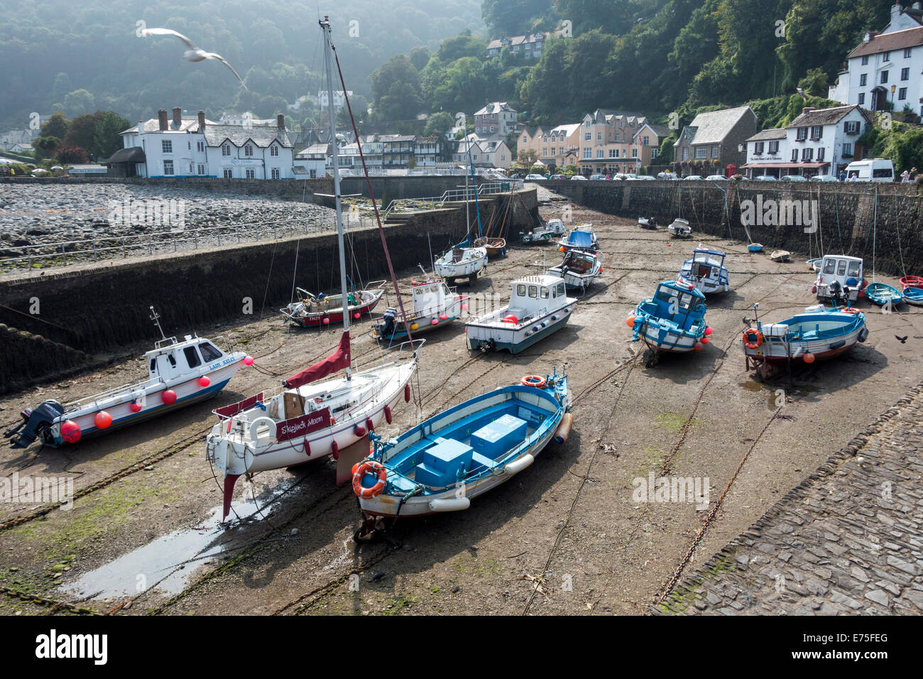 Boats at anchor at low tide in Lynmouth habour North Devon UK Stock Photo